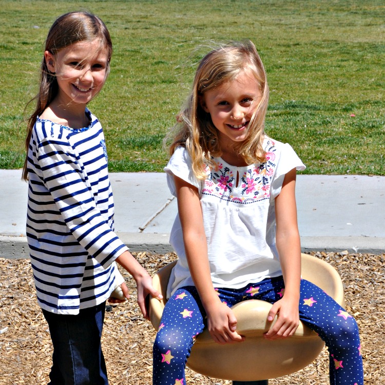 Zoë and Kaylee playing at the park in their new clothes