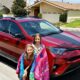 Zoë and Kaylee in front of the red Toyota RAV4 we reviewed