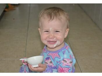 Baby Zoë with sour cream all over her face