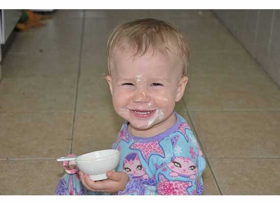 Baby Zoë with sour cream all over her face